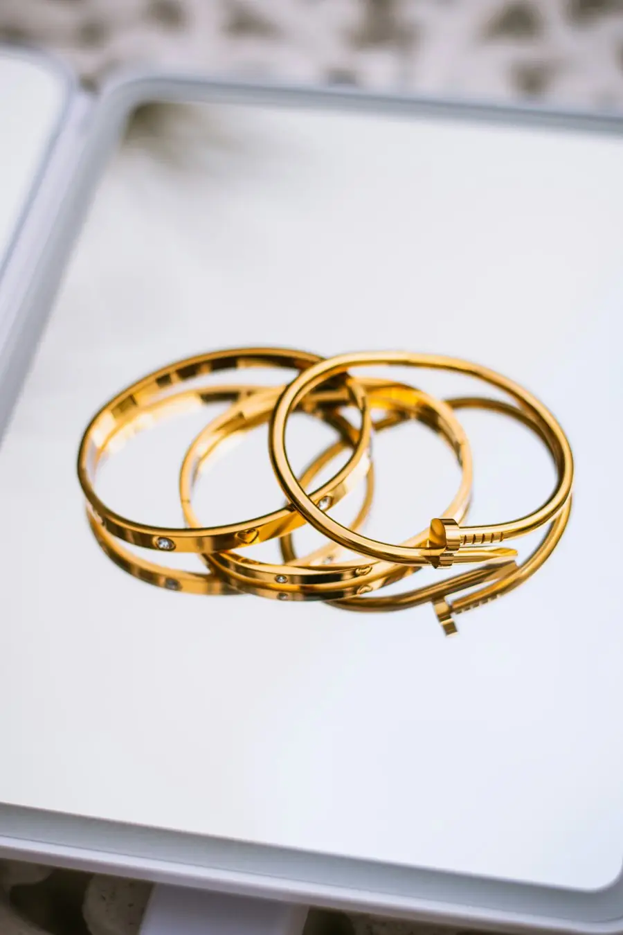 Gold bangles on a mirror