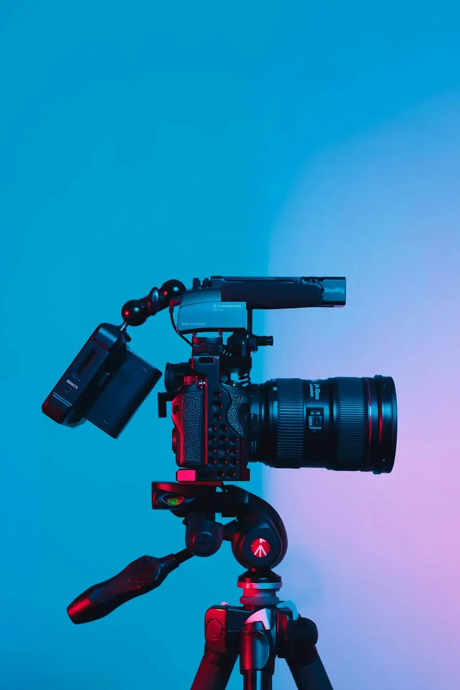 Video camera on a tripod in studio light